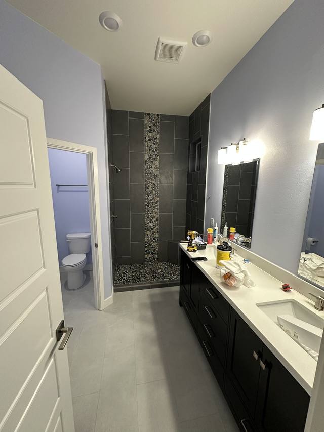 Tile & pebble accent installed